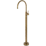 Brass freestanding bathtub faucet on a white background