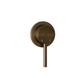 Bronze bathroom fixture with a lever handle on a white wall